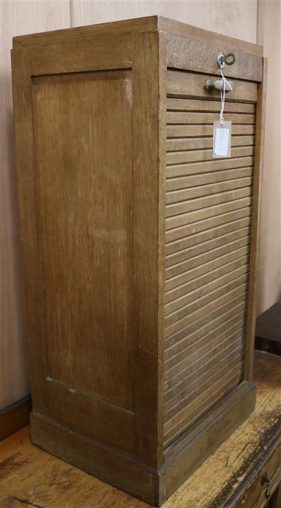 A small cabinet with a tambour shutter W.44cm